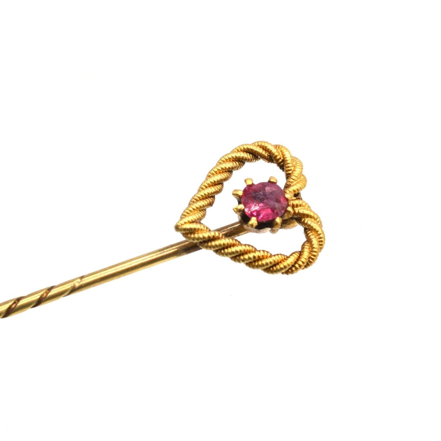 Edwardian 15ct gold knot heart tie pin featuring a natural ruby, elegant accessory for grooms or loved ones.