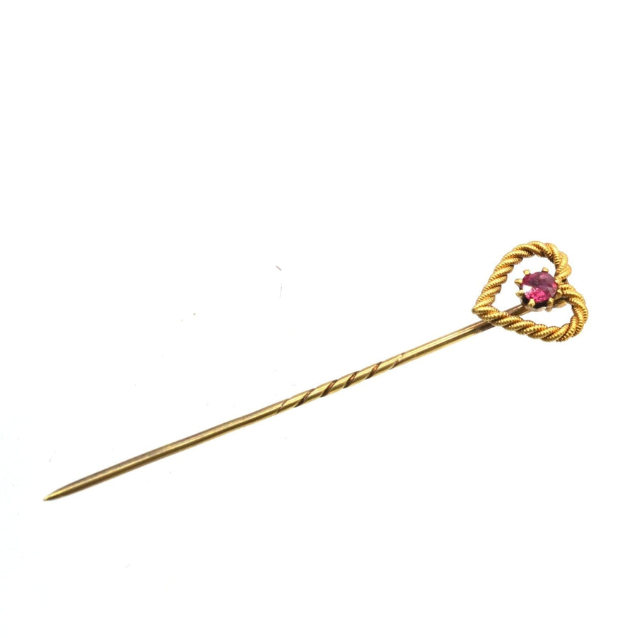 Edwardian 15ct gold knot heart tie pin featuring a natural ruby, perfect for a groom or loved one.