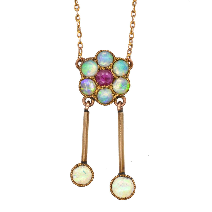 Edwardian 15ct gold pendant with ruby and opal cluster, featuring dual drop design, perfect for antique jewelry collectors.