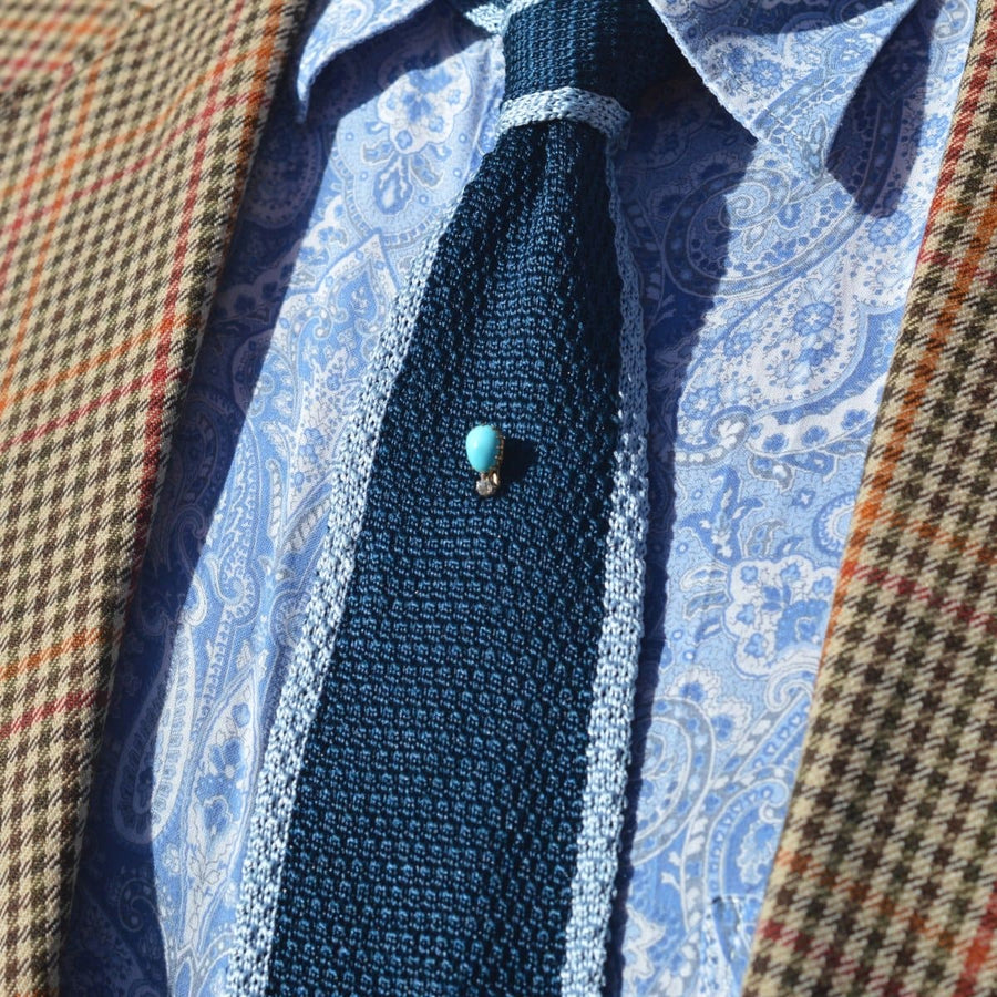 Classic blue tie featuring a vintage 15ct gold turquoise and diamond tie pin, perfect for a sophisticated look.