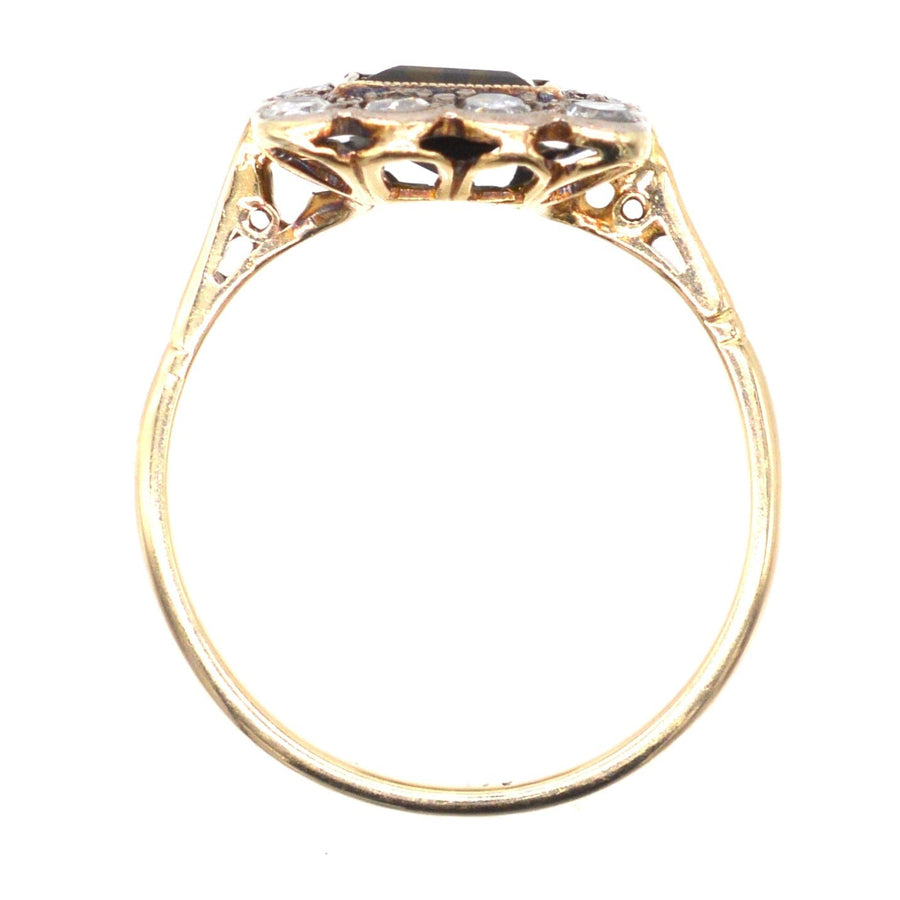 Edwardian 18ct gold and platinum square cluster ring featuring a green tourmaline and diamond accents.
