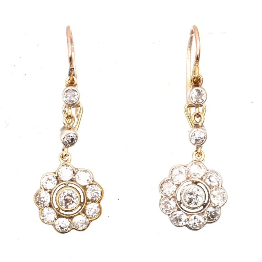 Edwardian 18ct gold diamond cluster drop earrings with flower design, showcasing sparkling diamonds and elegant craftsmanship.