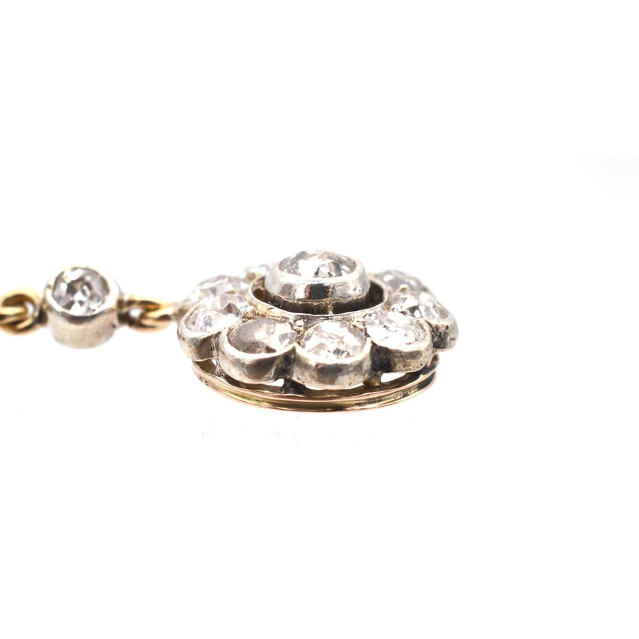 Edwardian 18ct gold and diamond cluster drop earring, showcasing intricate design and sparkling diamonds.