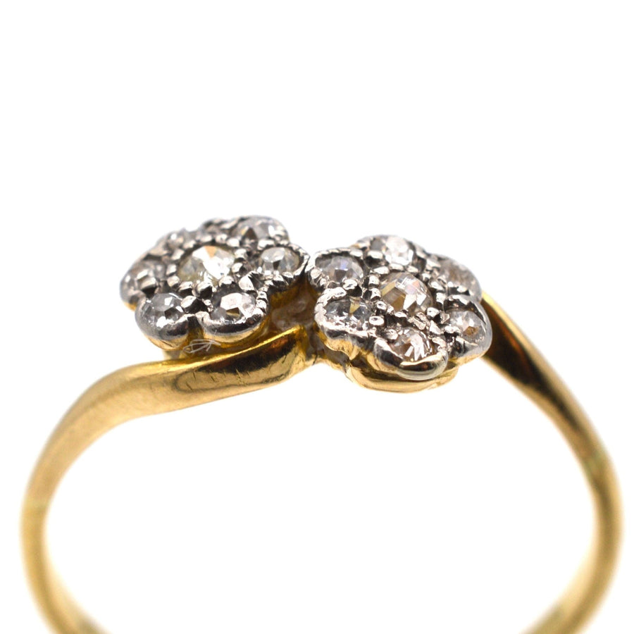 Edwardian 18ct gold double diamond cluster crossover ring featuring two floral designs, perfect for an engagement.