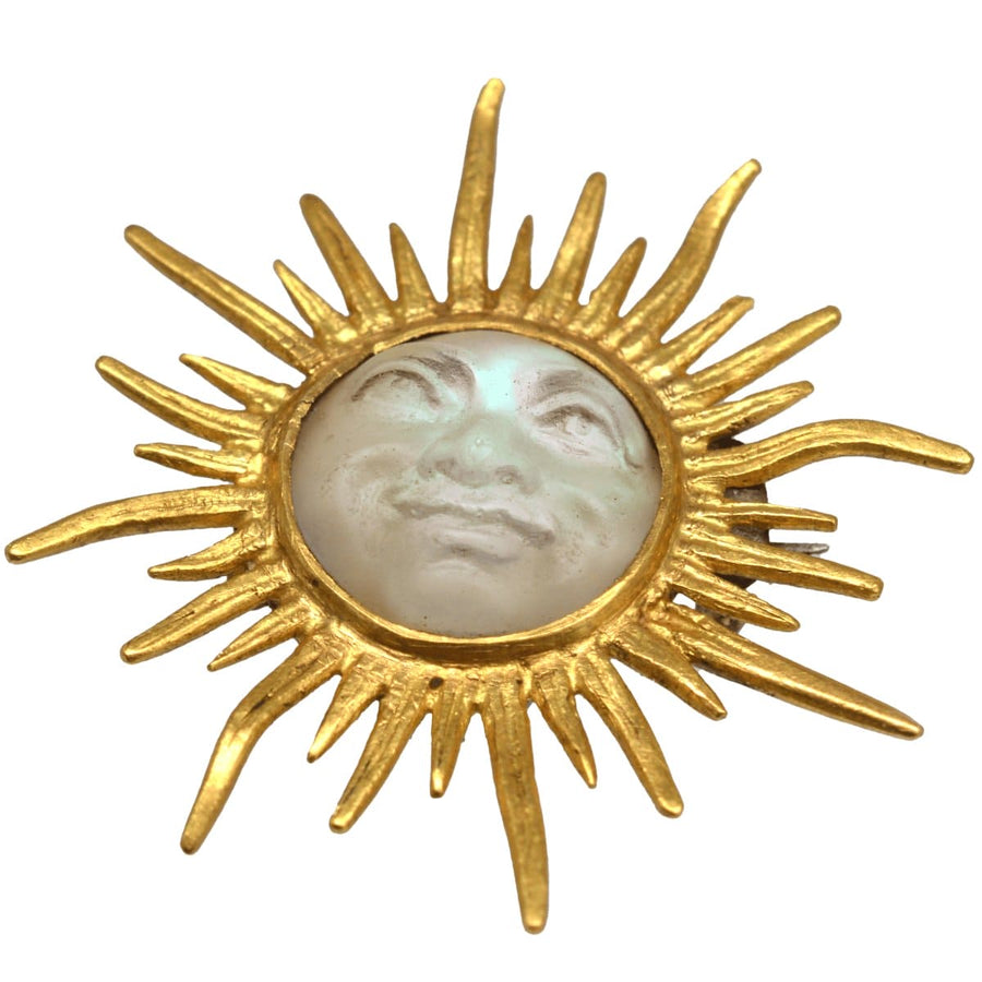 Edwardian 18ct gold sunburst brooch featuring opalescent glass Man in the Moon, circa 1910s.