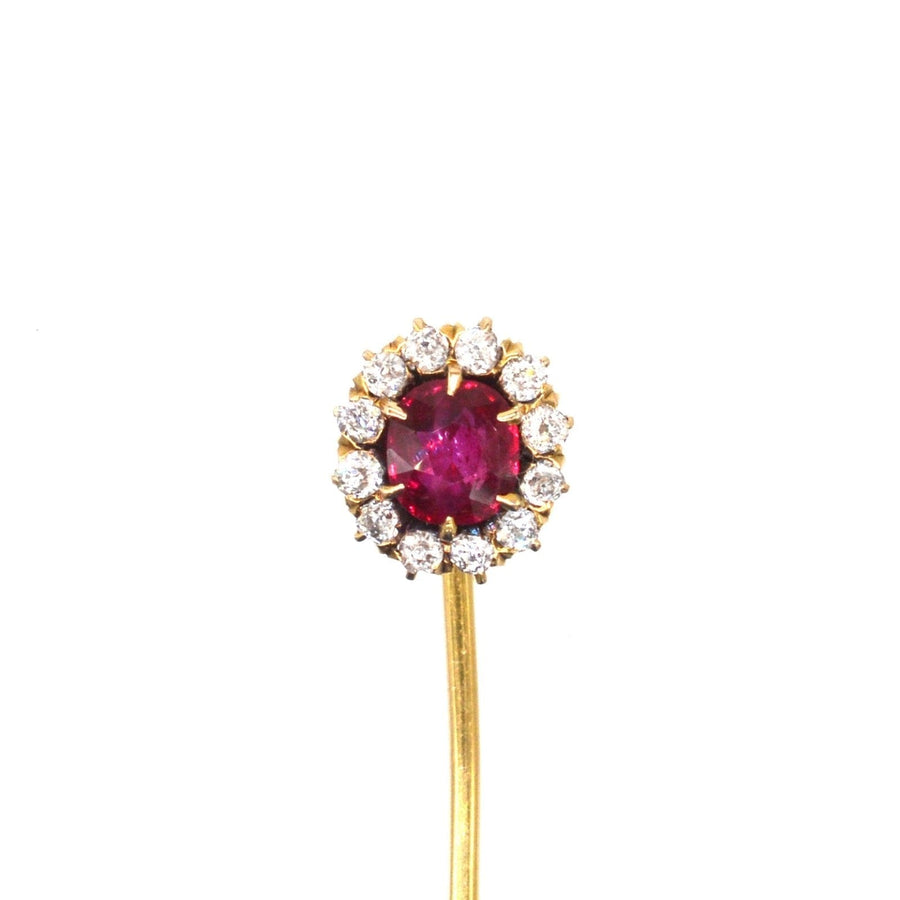 Edwardian 18ct gold tie pin featuring a pigeon blood red ruby and diamond cluster, circa 1900.