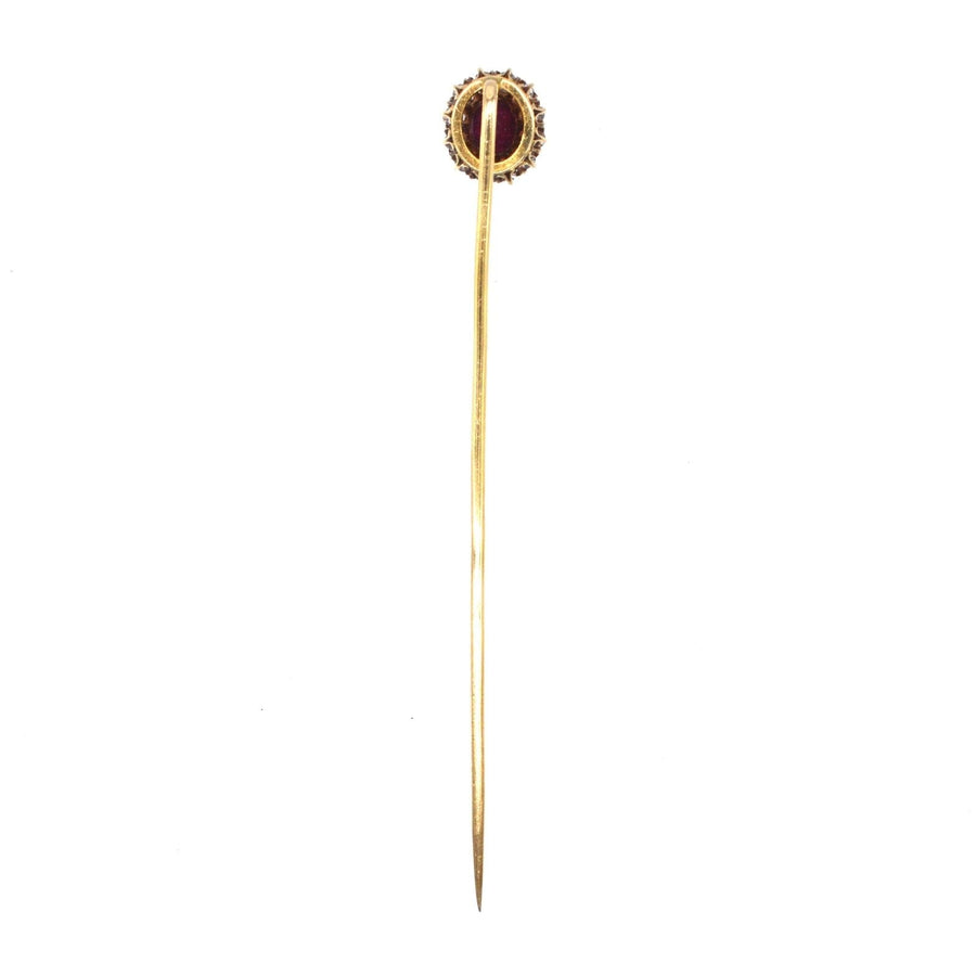 Edwardian 18ct gold tie pin featuring a vivid pigeon blood Burma ruby and diamond cluster, circa 1900.