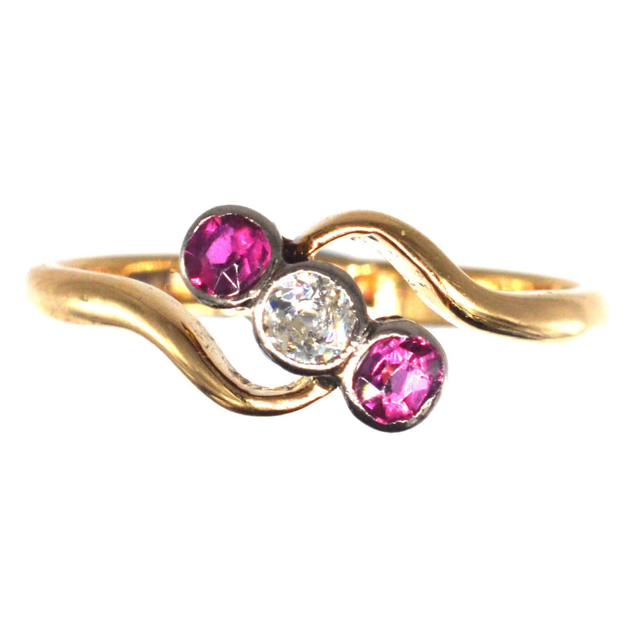 Edwardian 18ct gold crossover ring with ruby and diamond stones in Art Nouveau style.