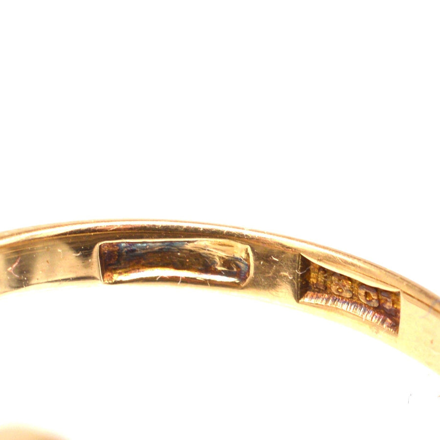 Inside view of Edwardian 18ct gold crossover ring showcasing hallmark details.