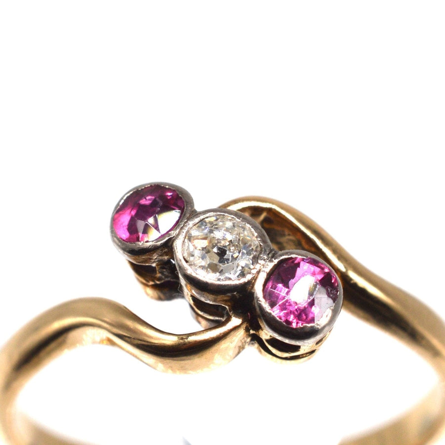 Edwardian 18ct gold and platinum crossover ring with ruby and diamond stones, ideal for engagement.