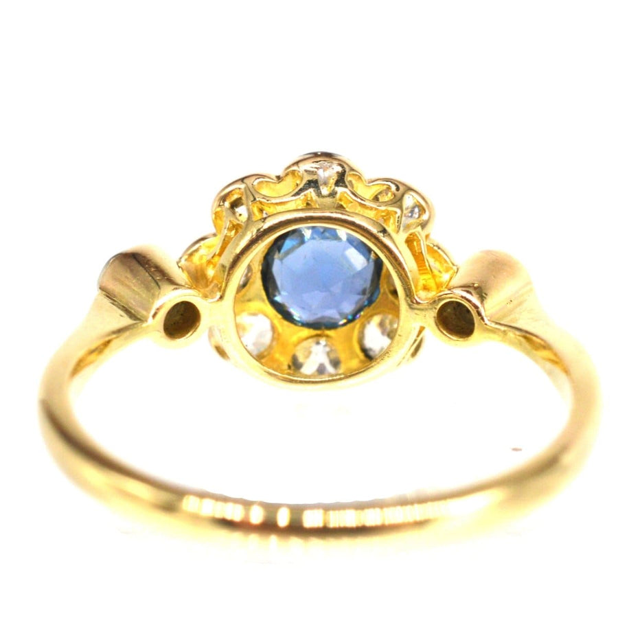 Edwardian 18ct gold ring with blue sapphire and diamond cluster, elegant design perfect for engagement or gifts.