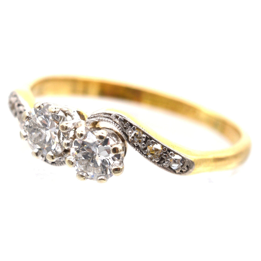 Edwardian 18ct Gold & Platinum two stone diamond 'Toi et Moi' crossover ring, featuring 0.20 carat diamonds.