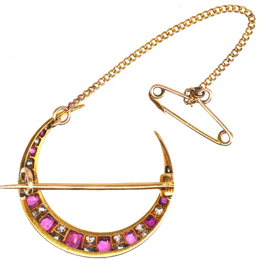 Edwardian 18ct gold crescent moon brooch with ruby and diamond accents