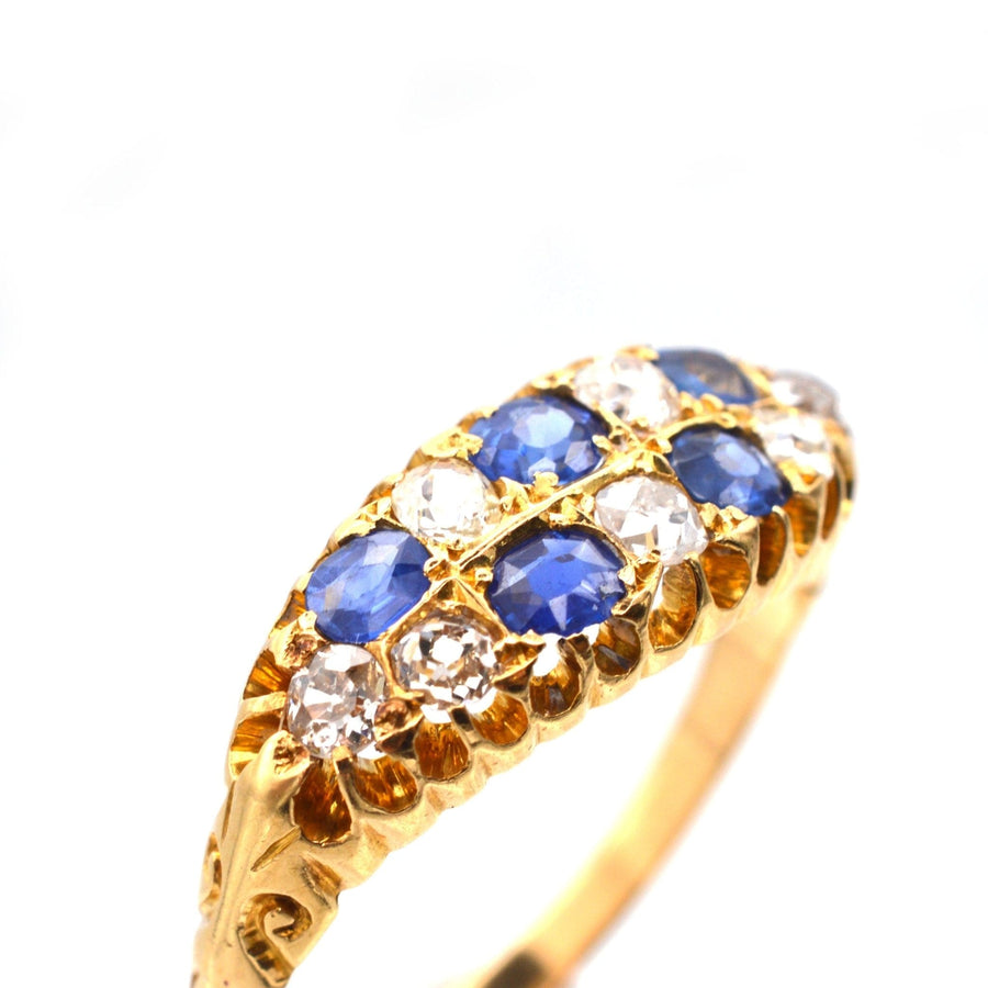 Edwardian 18ct gold ring with sapphires and old mine cut diamonds, boat shaped chequerboard design.