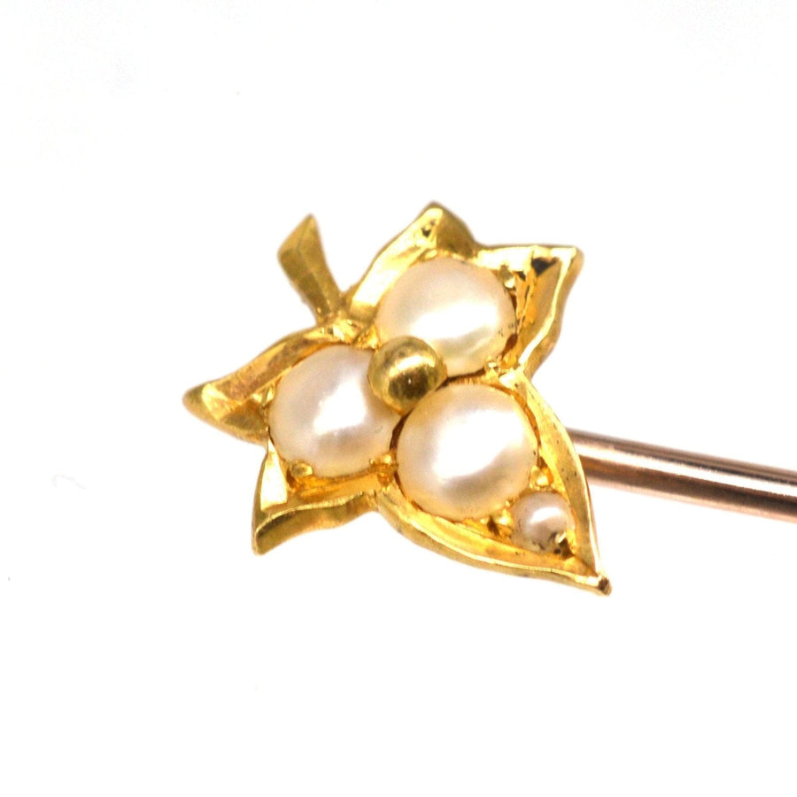 Edwardian 18ct gold ivy leaf tie pin adorned with split pearls, symbolizing love and devotion.