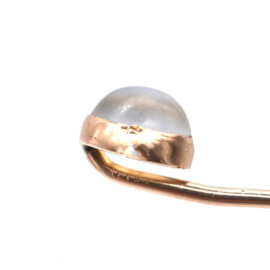 Close-up of an Edwardian 18ct gold tie pin featuring a moonstone, showcasing its unique bluey grey sheen.