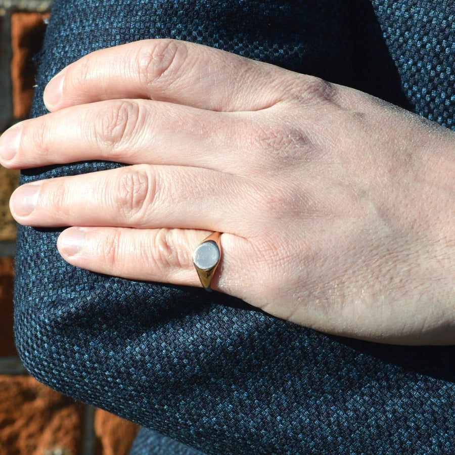 Edwardian 18ct rose gold plain signet ring worn on hand, showing its elegant design and unique condition.