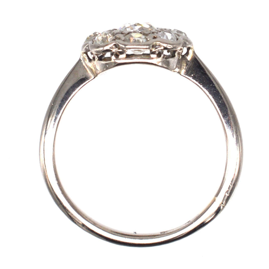 Edwardian 18ct white gold diamond cluster ring featuring an elegant 0.40ct central stone with eight surrounding diamonds.