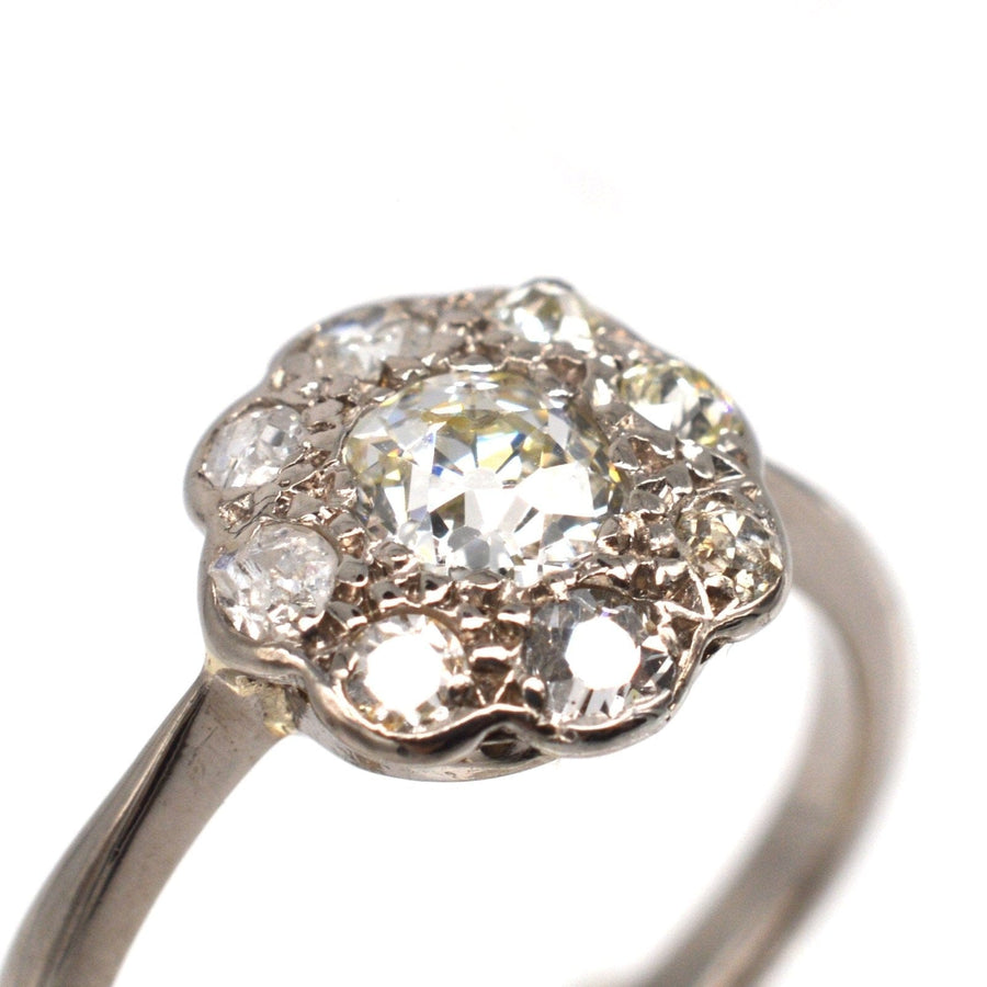 Edwardian 18ct white gold diamond cluster ring with 0.40ct center stone and small diamonds, ideal for engagement.