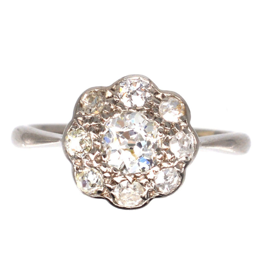 Edwardian 18ct white gold ring featuring a central 0.40ct diamond cluster with eight smaller diamonds.