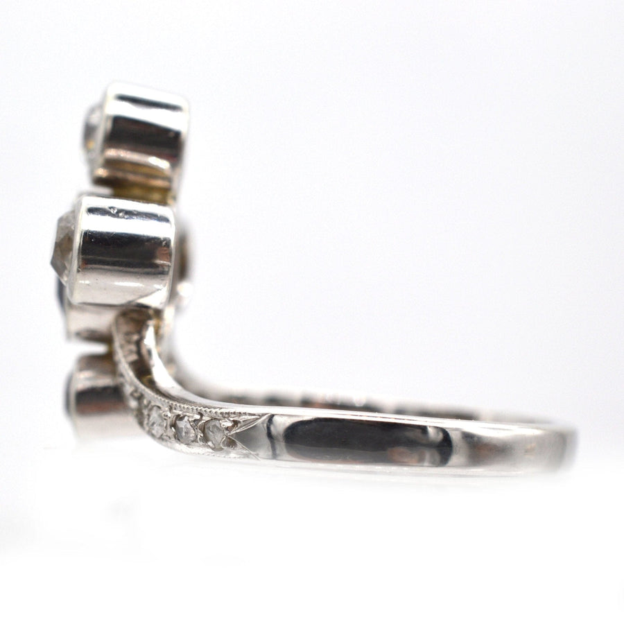 Edwardian 18ct white gold tiara ring featuring sapphire and diamond detailing, side view with intricate design.