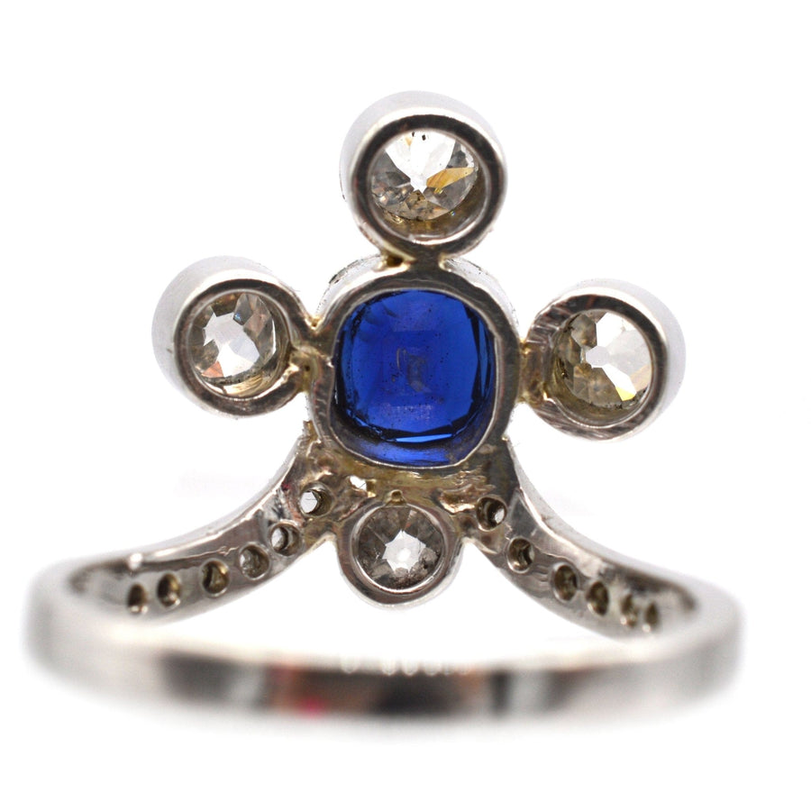 Edwardian 18ct white gold tiara ring featuring a blue sapphire and diamond accents, showcasing historical elegance.