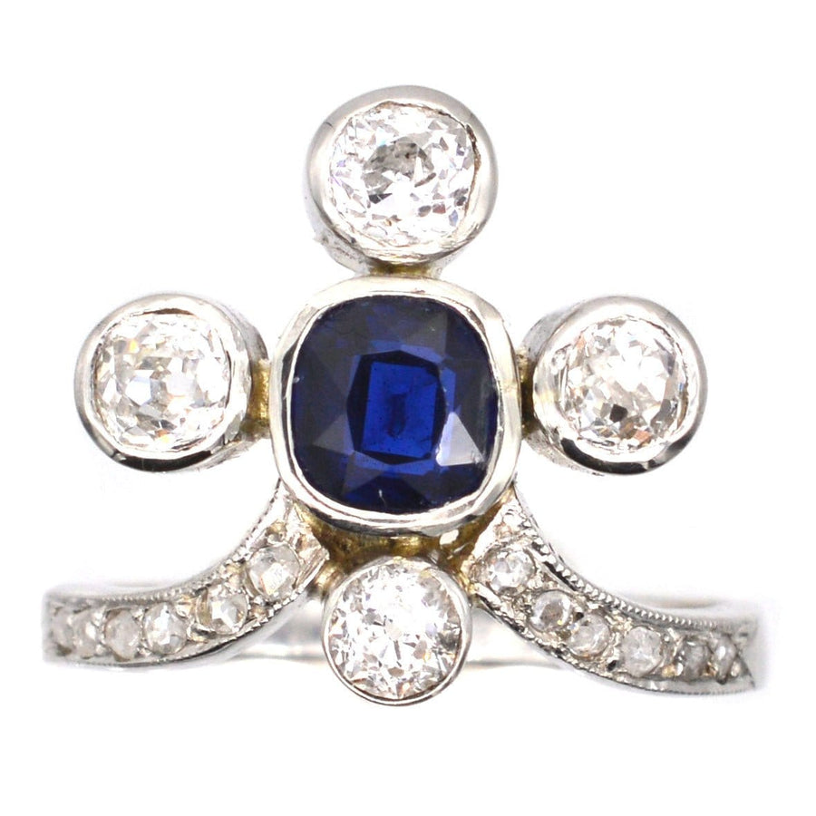 Edwardian 18ct white gold tiara ring featuring a rich blue sapphire and diamond accents, inspired by Belle Epoque design.