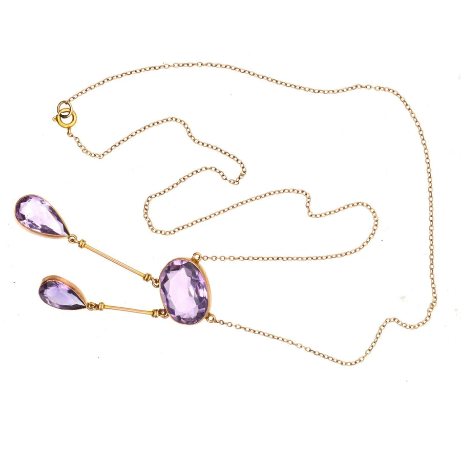 Edwardian 9ct gold amethyst double drop lavalliere necklace with elegant purple stones and delicate chain.