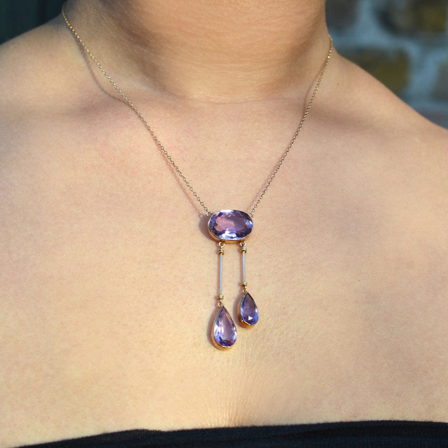 Edwardian 9ct gold lavalliere necklace with amethyst double drop pendant shown on model.