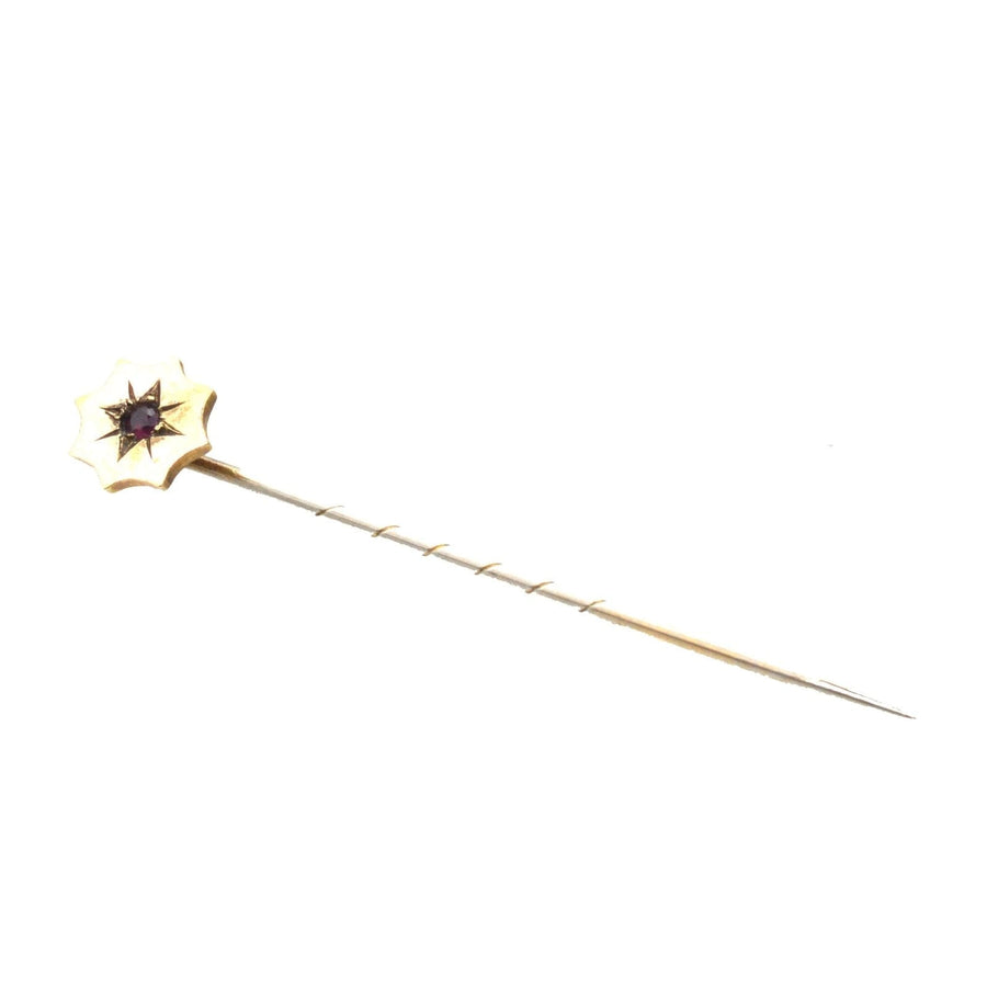 Edwardian 9ct gold tie pin featuring a natural ruby, perfect for enhancing a colorful silk tie.