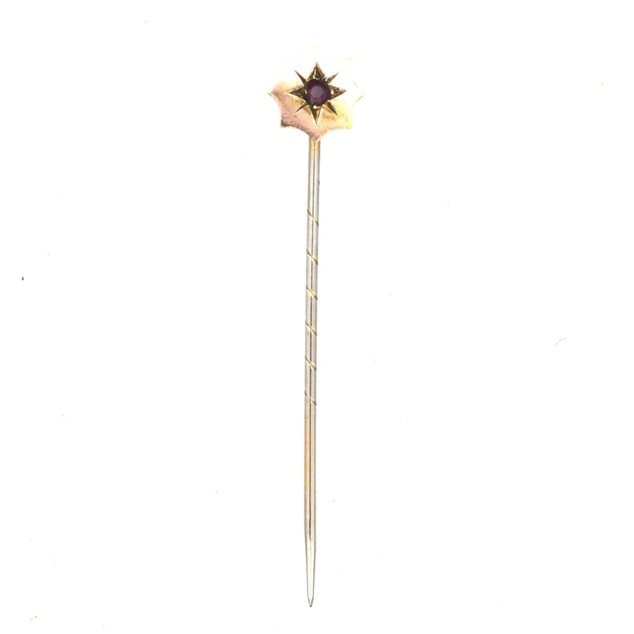 Edwardian 9ct gold tie pin featuring a ruby star design, perfect for colorful silk ties, includes a stopper.