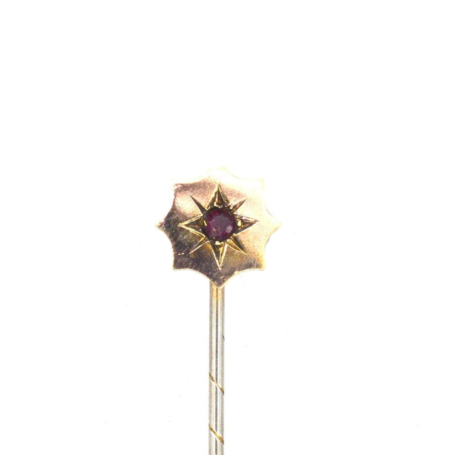 Edwardian 9ct gold tie pin featuring a star design with a natural ruby at its center, perfect for a silk tie.