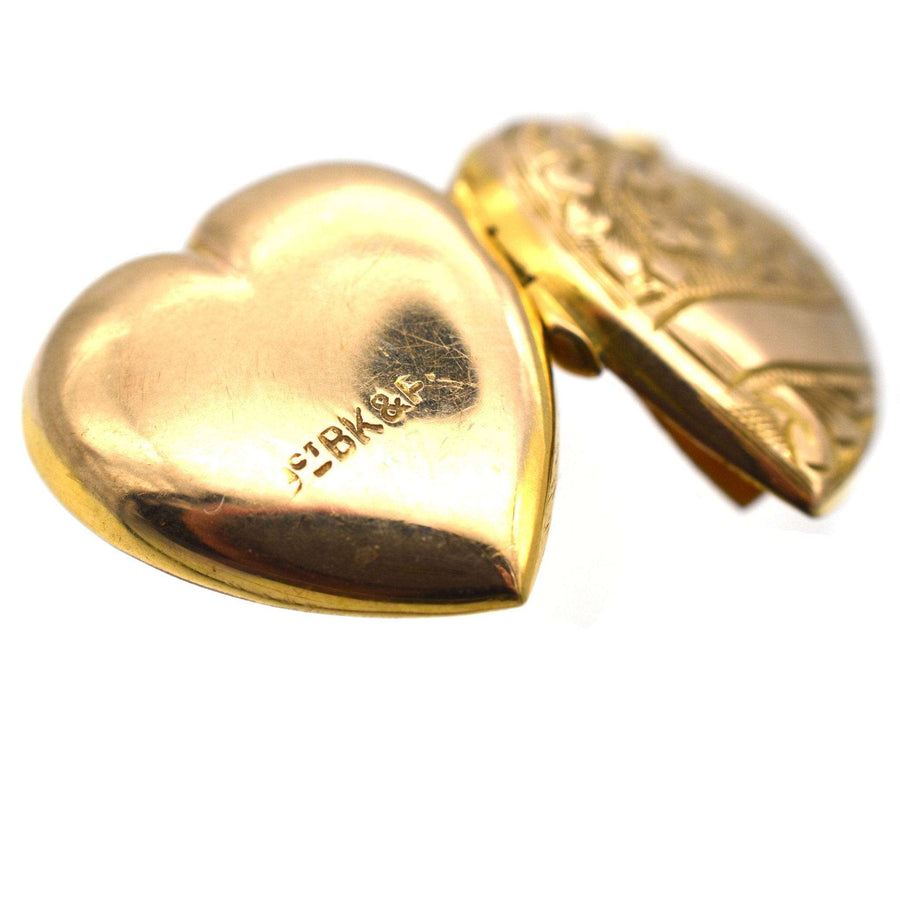 Edwardian 9ct gold heart locket with engraved scroll motifs, circa 1900-1910.