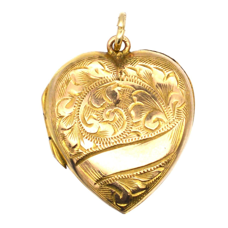 Edwardian 9ct gold heart locket pendant with engraved scroll motifs, dating from 1900-1910.