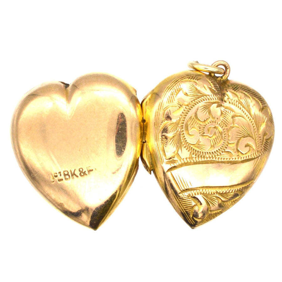 9ct gold heart locket pendant with engraved scroll motifs, circa 1900-1910, solid back and front design.