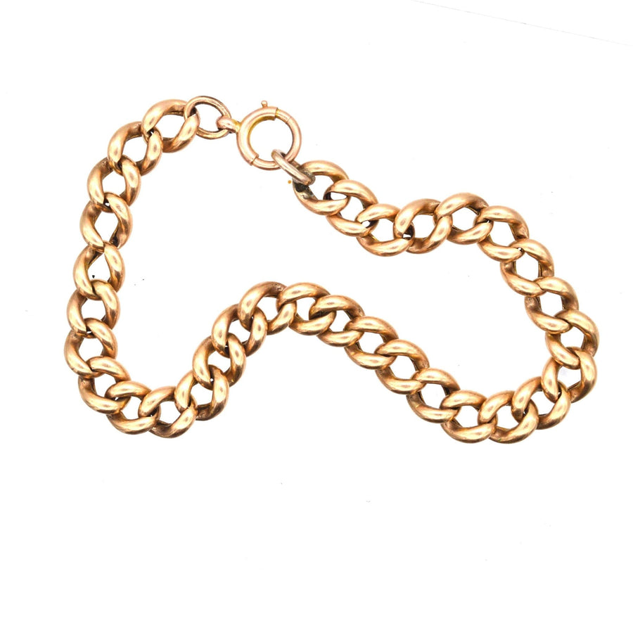 Edwardian 9ct gold curb bracelet showcasing rich design and elegant links, lightly worn, weighing 11.4g.