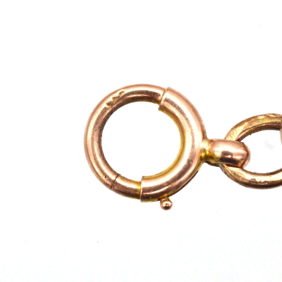 Close-up of the clasp detail on a vintage Edwardian 9ct gold curb bracelet, showcasing intricate design and craftsmanship.