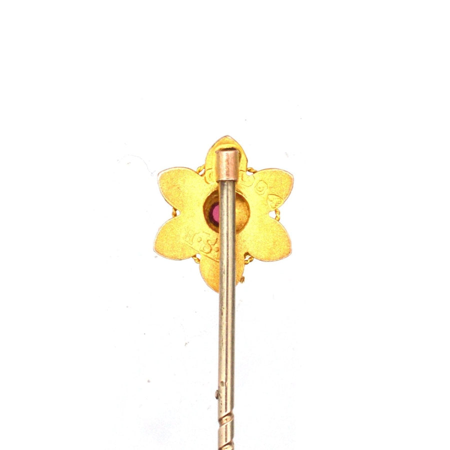 Edwardian 9ct gold flower tie pin with a ruby, crafted by E F Braham Ltd, circa 1900s.