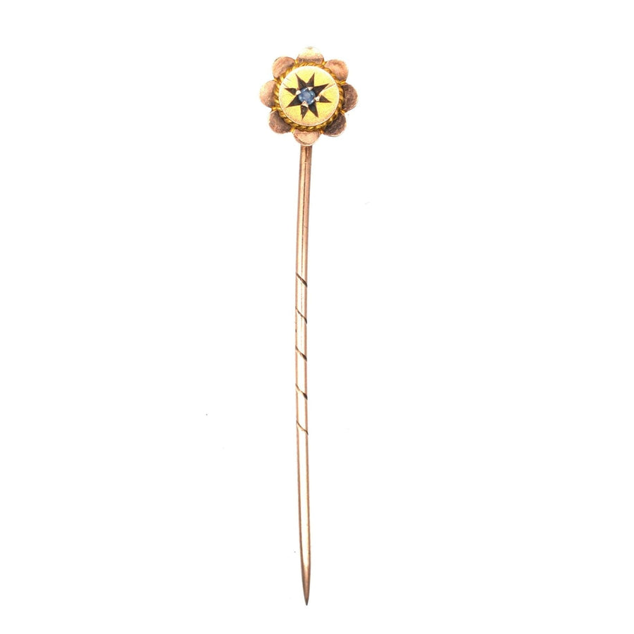 Edwardian 9ct gold flower tie pin featuring a sapphire, ideal accessory for a colorful silk tie.