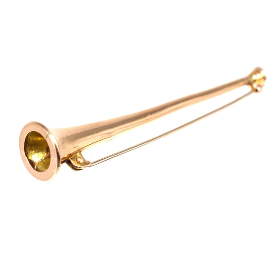 Elegant miniature Edwardian 9ct gold hunting horn brooch, perfect for lapels or ties, adding a quirky touch to any outfit.