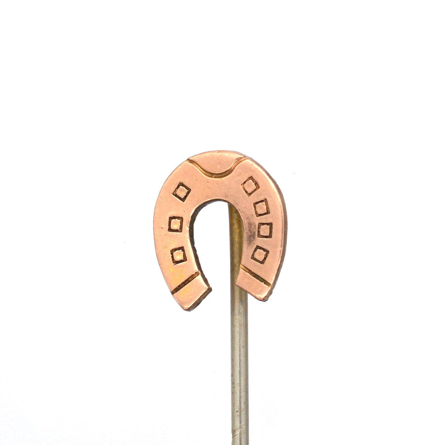 Edwardian 9ct gold lucky horseshoe tie pin symbolizing good luck and protection from evil.
