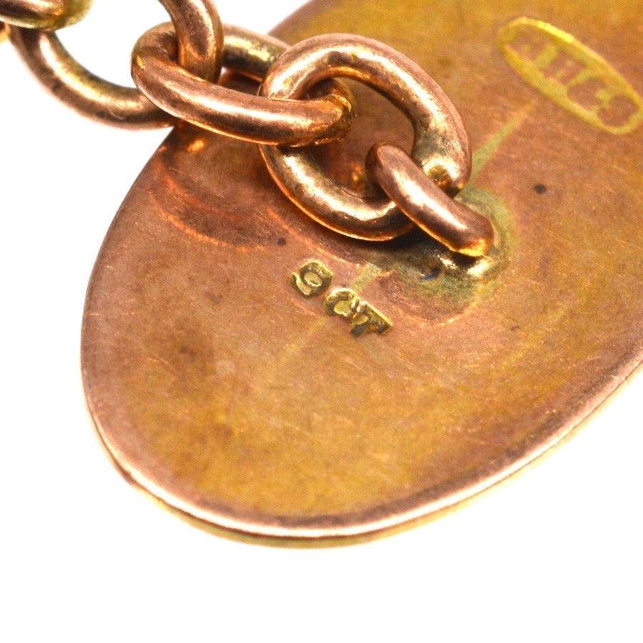 Detail of 9ct gold hallmark on Edwardian cufflinks, showcasing quality craftsmanship and vintage charm.
