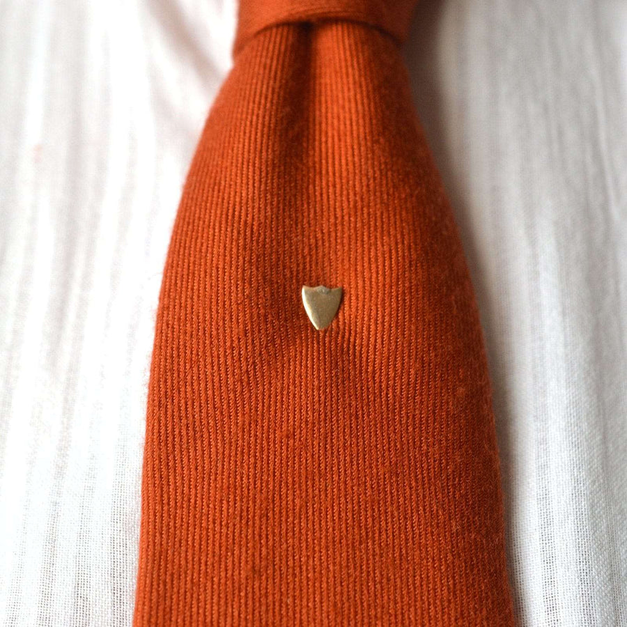 Edwardian 9ct gold shield tie pin on an orange tie, elegant and modern design suitable for engraving.