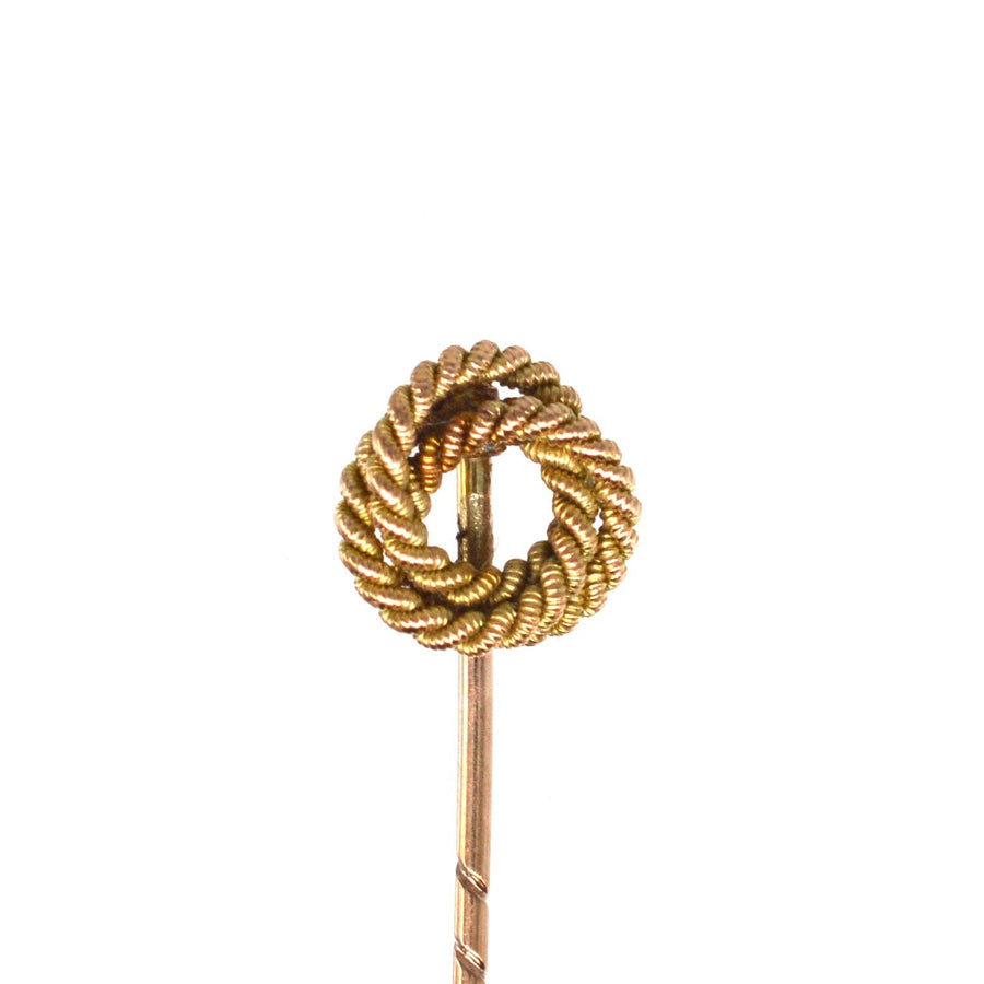 Edwardian 9ct gold round double knot rope tie pin, symbolizing love and commitment, perfect for ties or lapels.