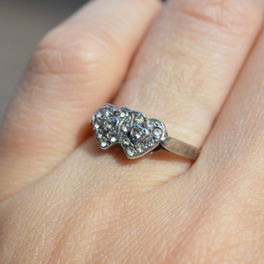 Edwardian 9ct gold and silver double heart paste ring showcasing timeless elegance and sentimental design.