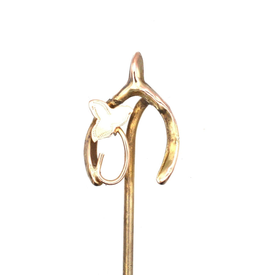 Edwardian 9ct gold wishbone tie pin with ivy leaf design, symbolizing good luck and everlasting love.