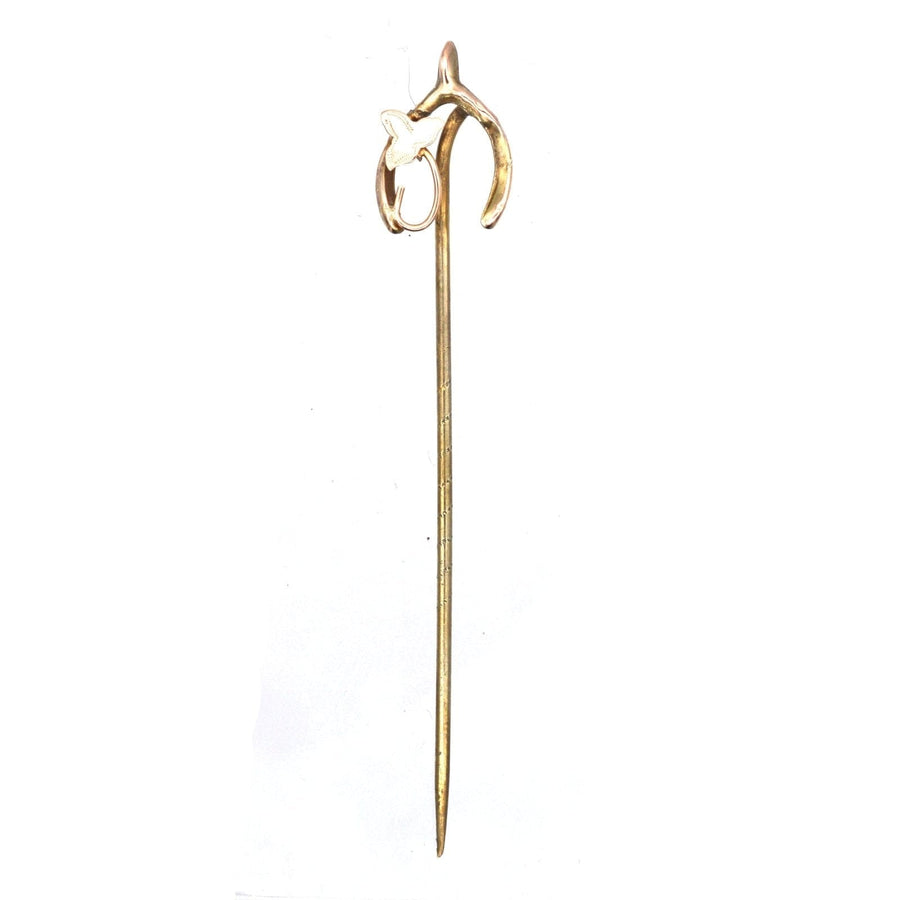 Edwardian 9ct gold wishbone tie pin with ivy leaf design, symbolizing good luck and everlasting love.