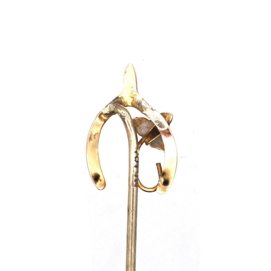 Edwardian 9ct gold wishbone tie pin with ivy leaf, symbolizing good luck and everlasting love.