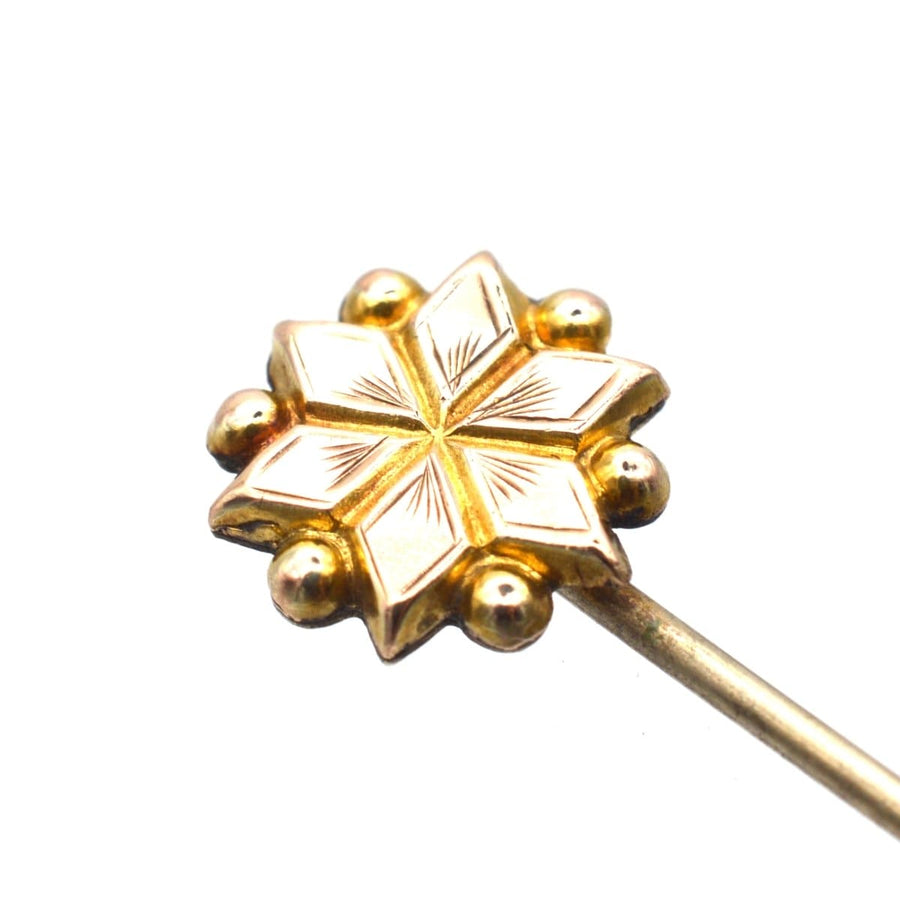 Edwardian gold plated star tie pin featuring a stylish design with decorative details, ideal for colorful silk ties.