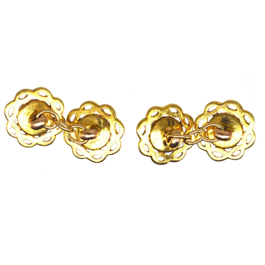 Antique gold cufflinks with scalloped design and connecting chain, perfect for formal attire.